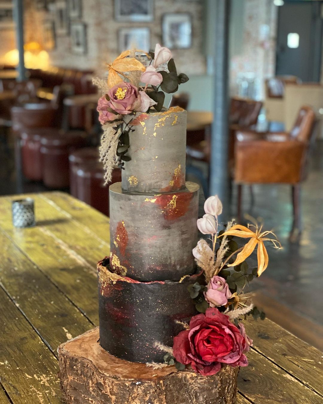 fall gothic grey and black wedding cake with flowers via baked.by.alice