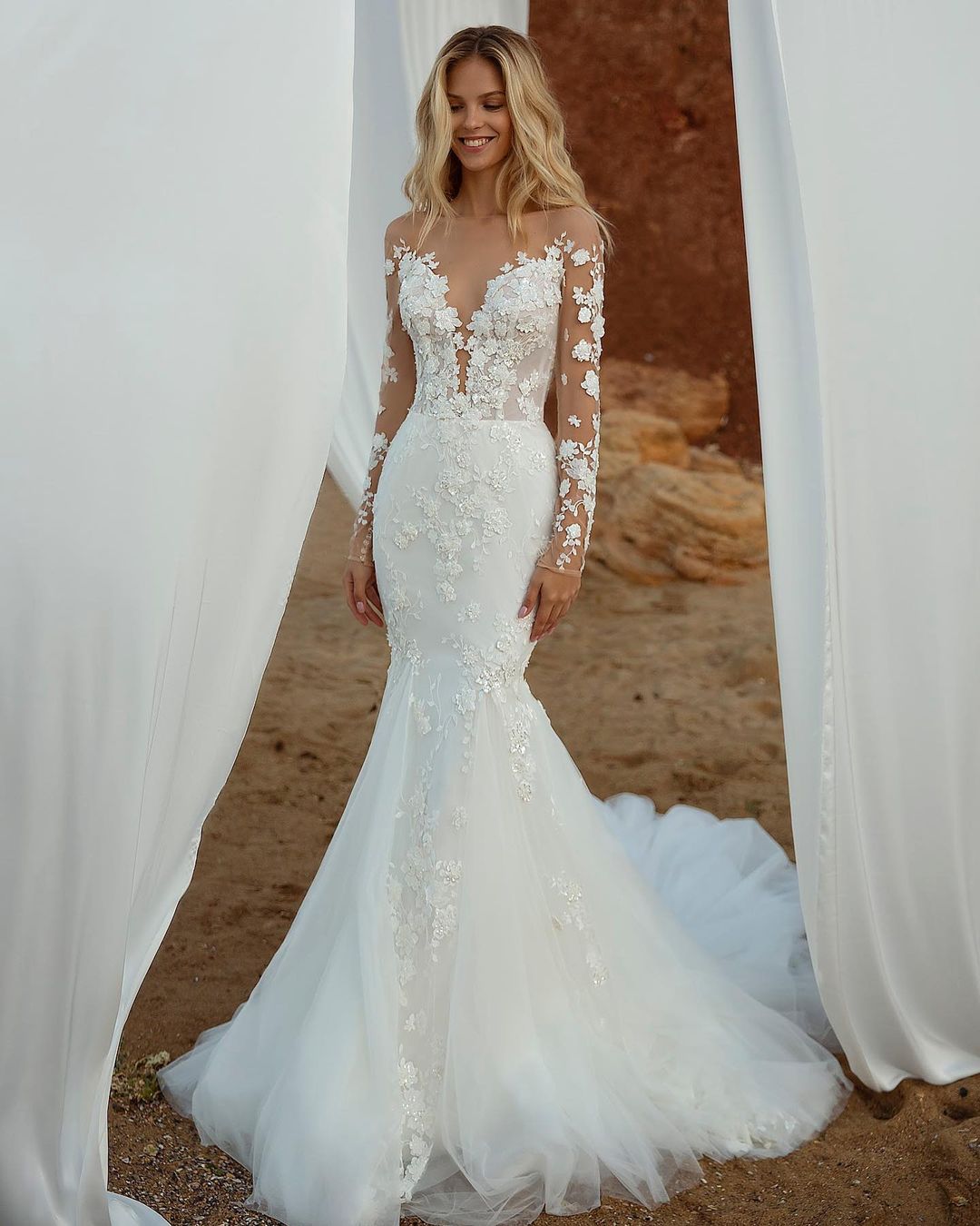 fit and flare wedding dress with long lacce sleeves via royaldiofficial