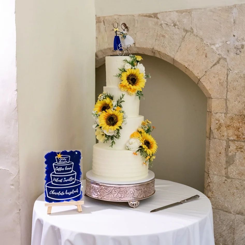four tier wedding cake with sunflowers via babycakes.guildford