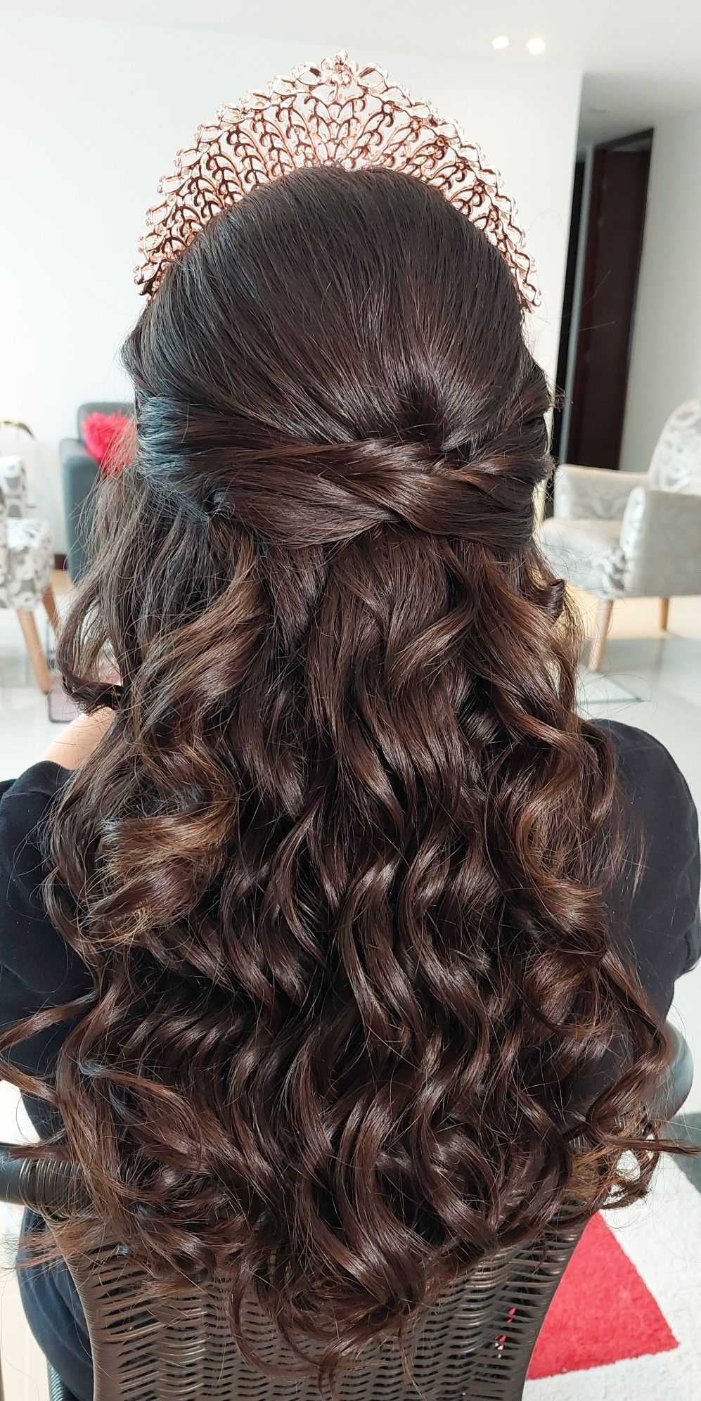 long wavy quinceanera hairstyle down with red crown
