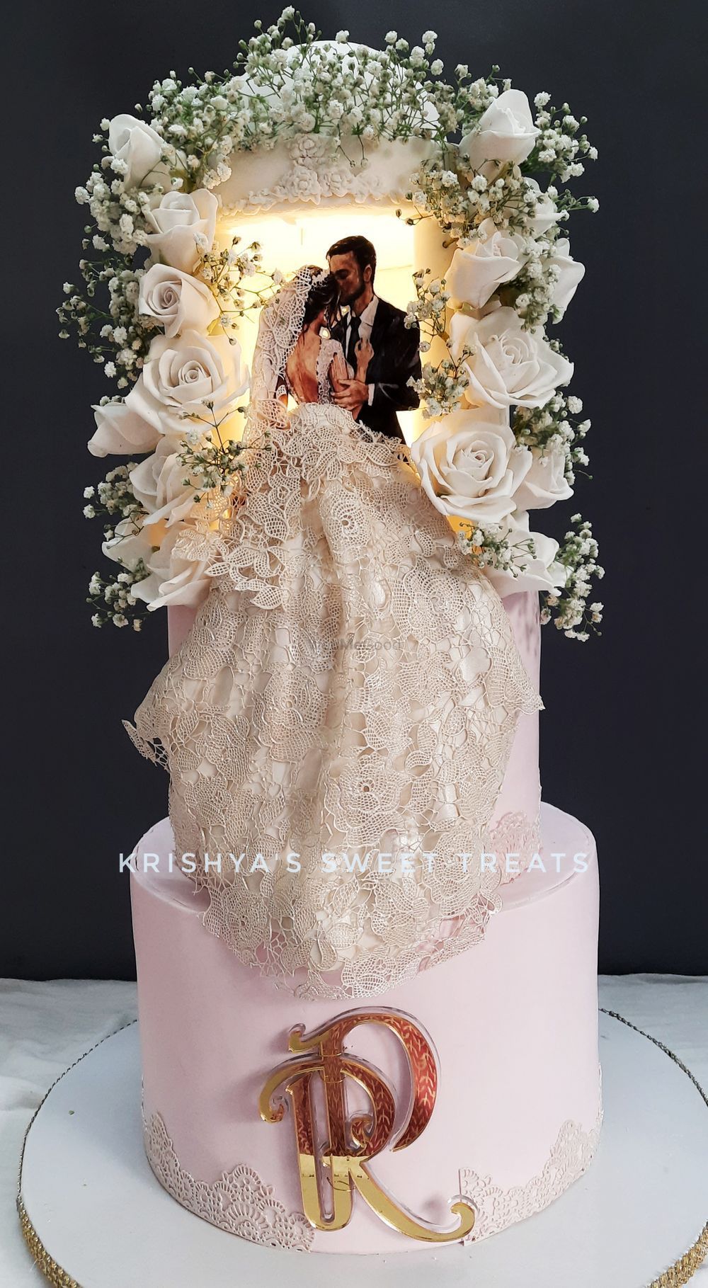 luxury bohemian wedding cake with 3d couple topper and sugar flowers