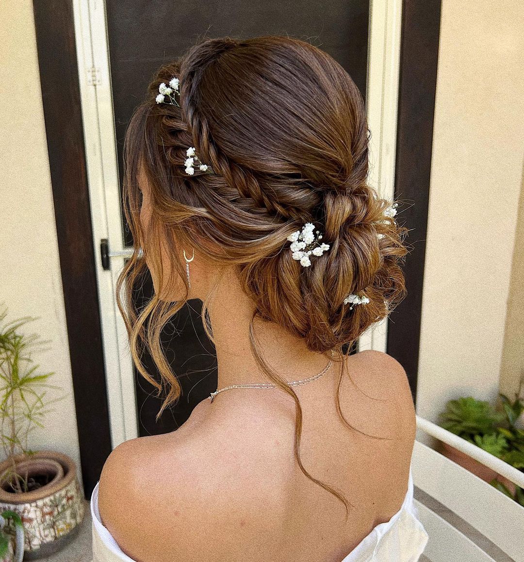 messy braided crown boho updo hairstyle with flowers via zhanna_syniavsk