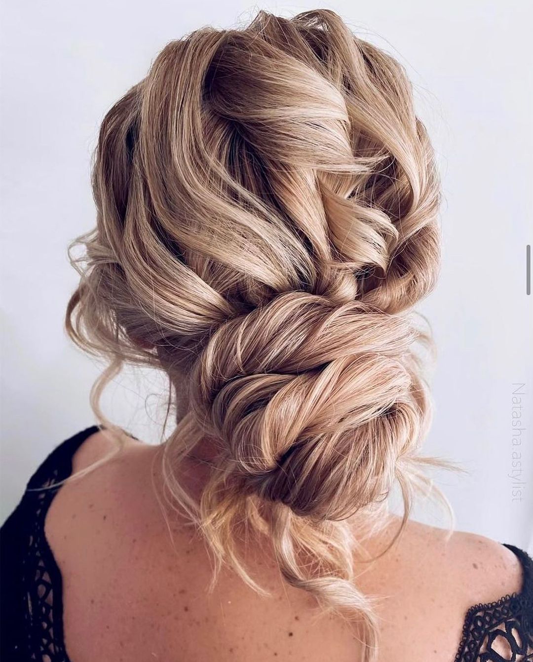 messy curly bridesmaid updo hairstyle via natasha.astylist