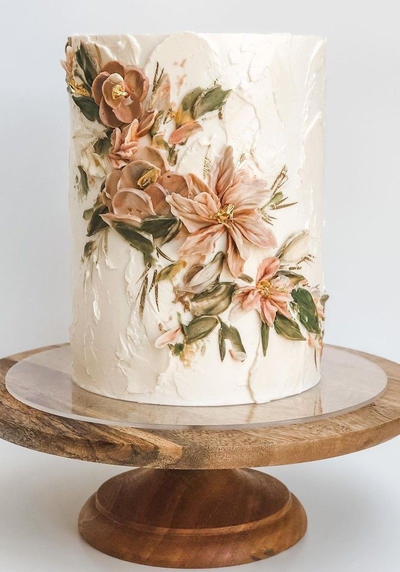 one tier buttercream wedding cake with dusty orange scraper flowers
