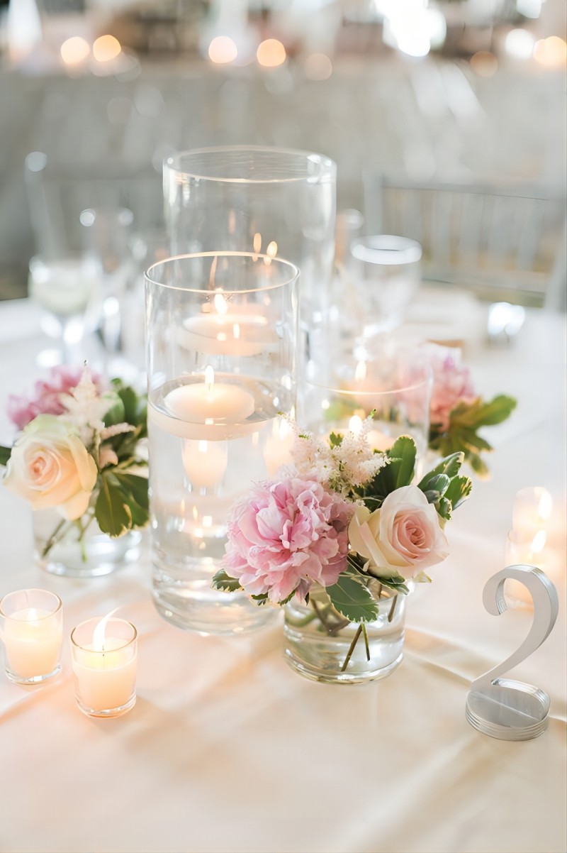 pink and blush flowers with candles wedding centerpiece