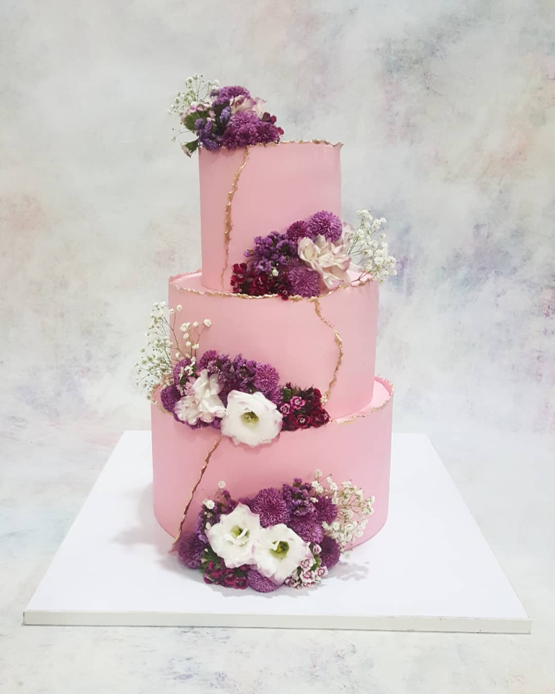pink wedding cake with plum flowers via fady.cake