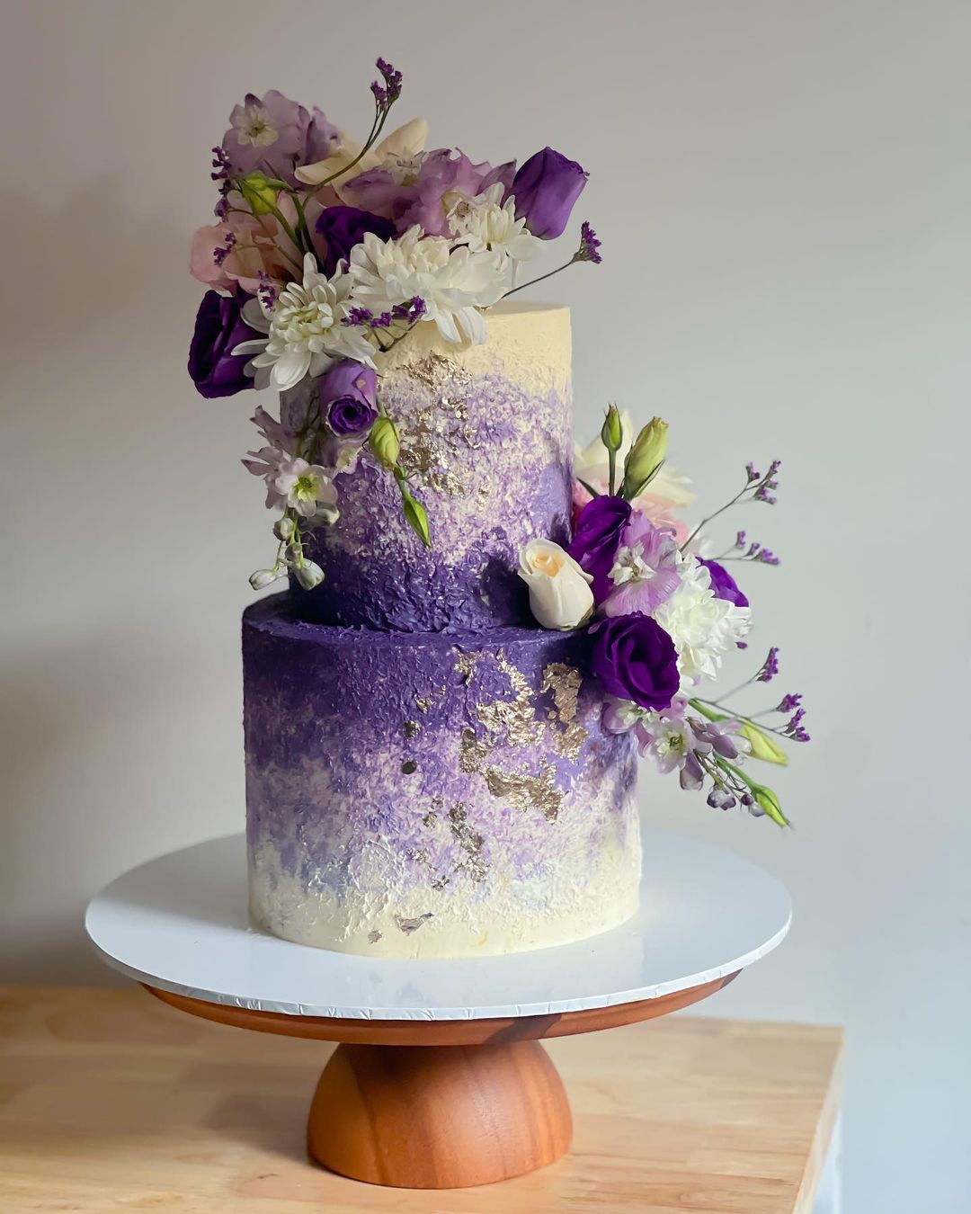 purple and gold foil wedding cake via madbatterbysavcakery