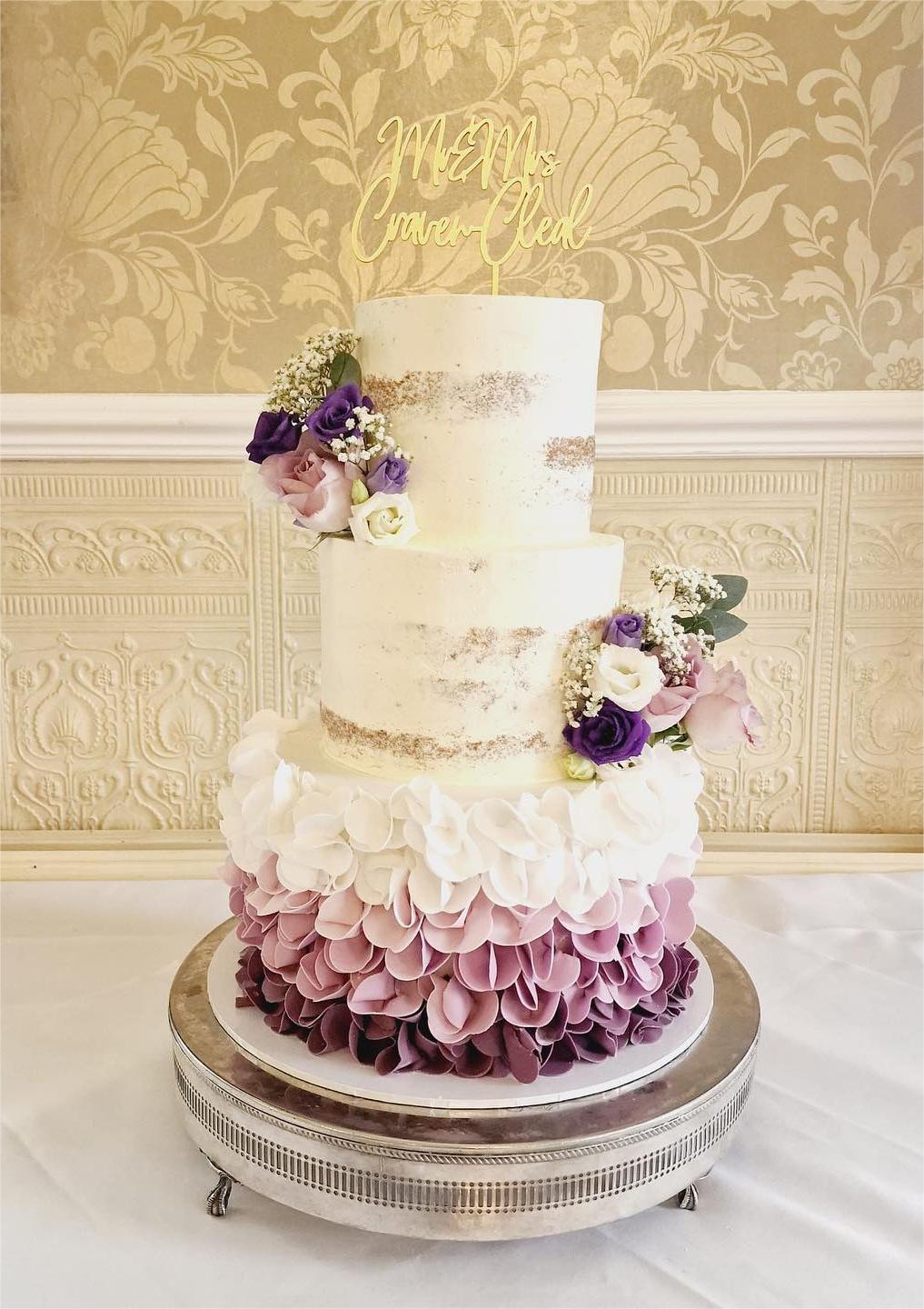 semi-naked wedding cake with purple ombre ruffles wedding cake via barbi_linnacakes