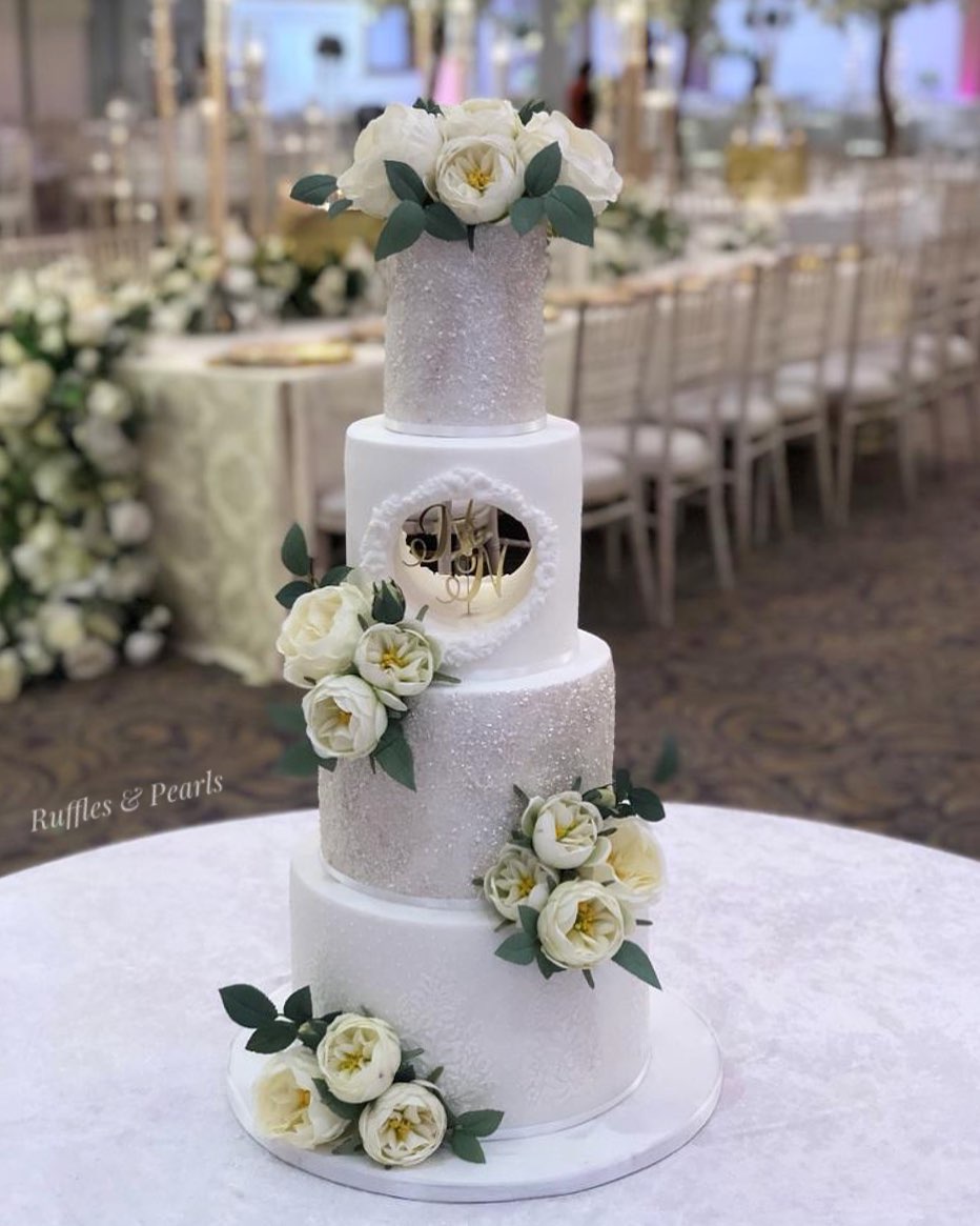 silver and white matte frosted 4 tier wedding cake with flowers via rufflesandpearls