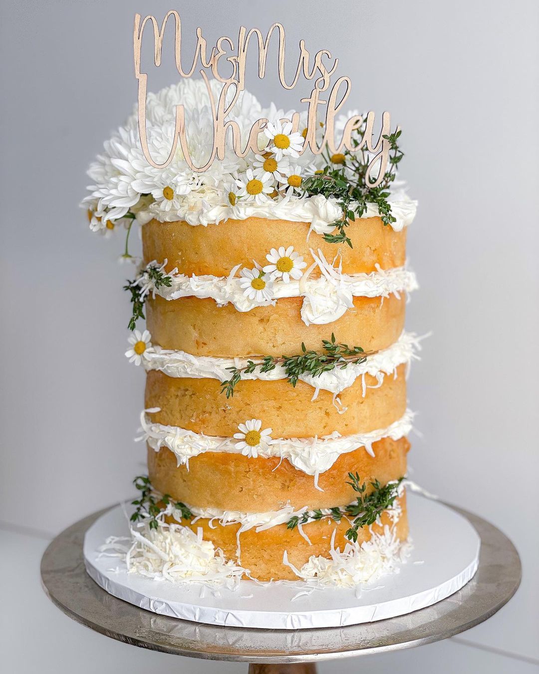 simple naked lemon wedding cake with white flowers via cakes_by_angelica