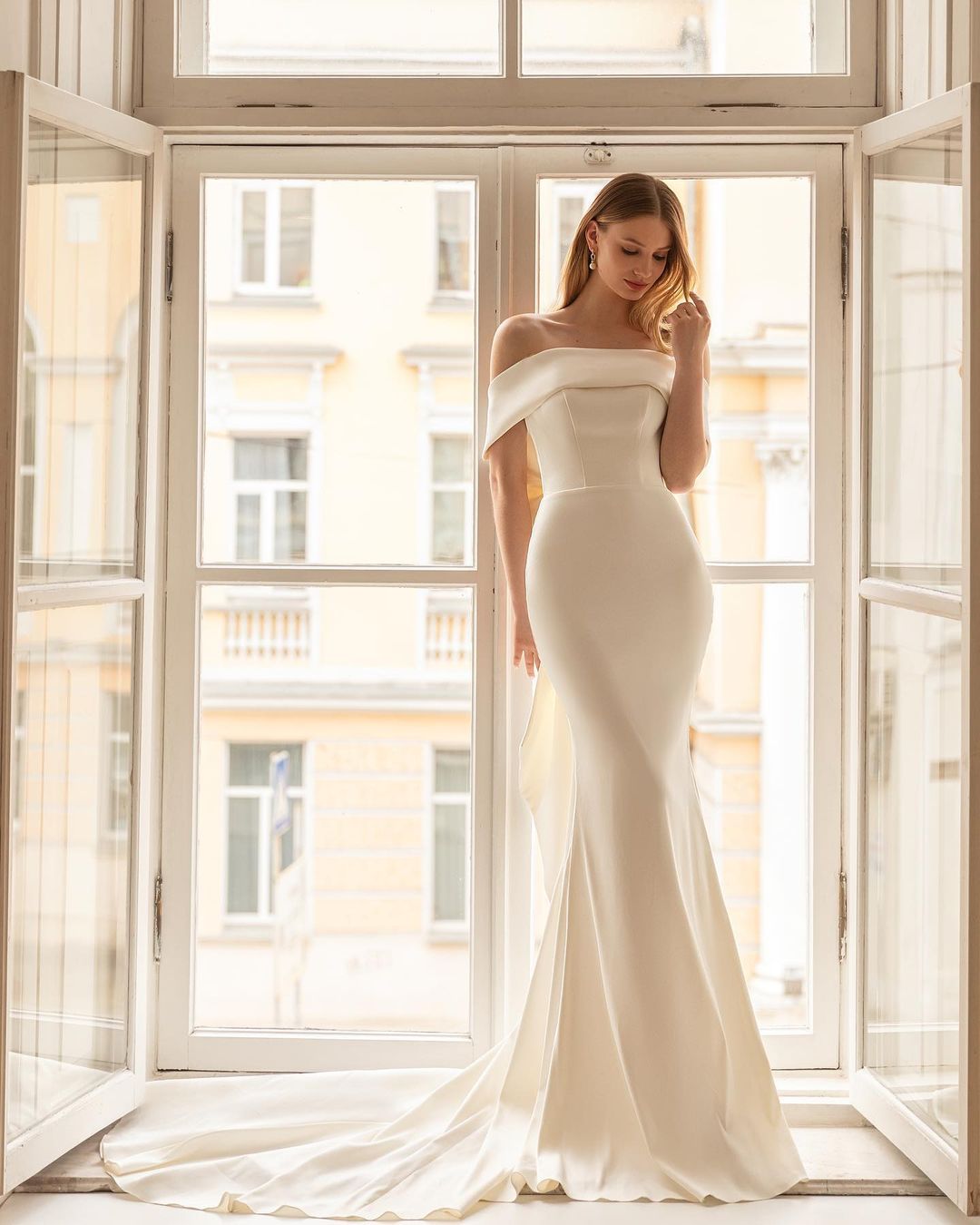 simple satin off the shoulder fit and flare bridal dress