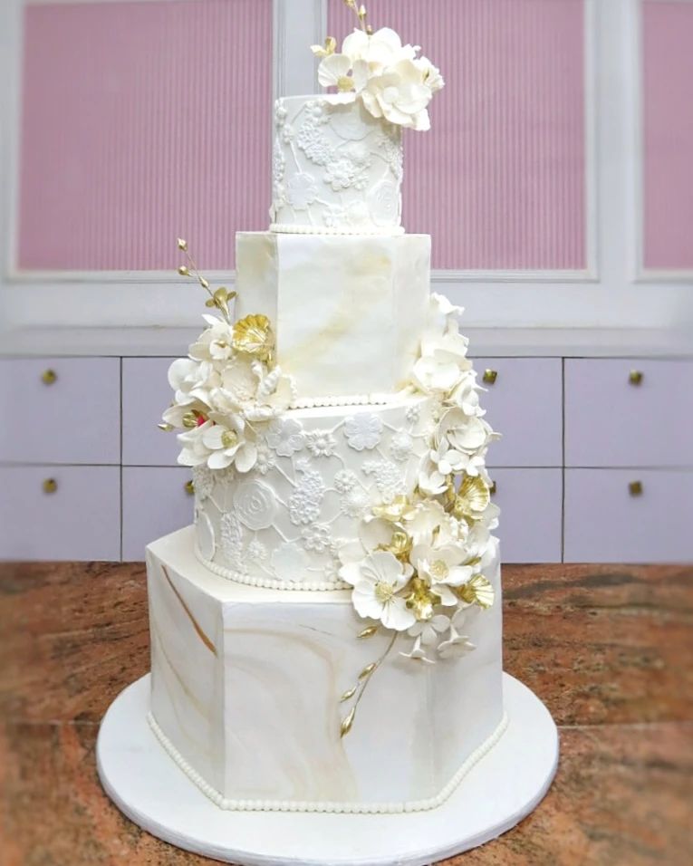 vintage 4 tier geo shaped white and gold wedding cake via cakes_by_la