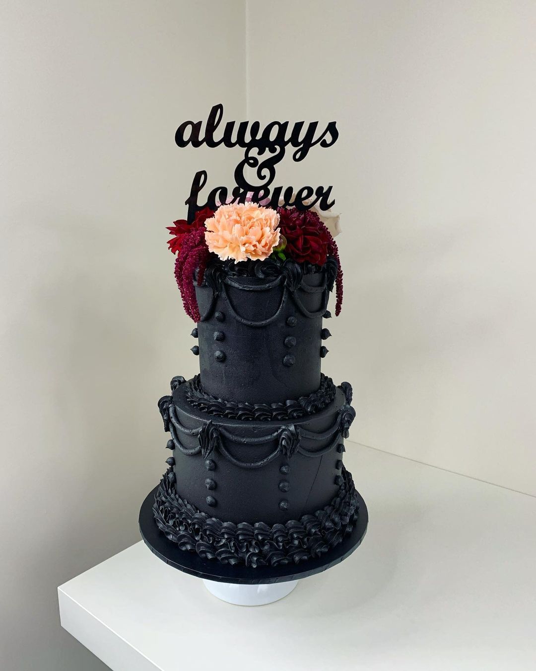 vintage black gothic wedding cake with red flowers via sweetbymeredithmullen