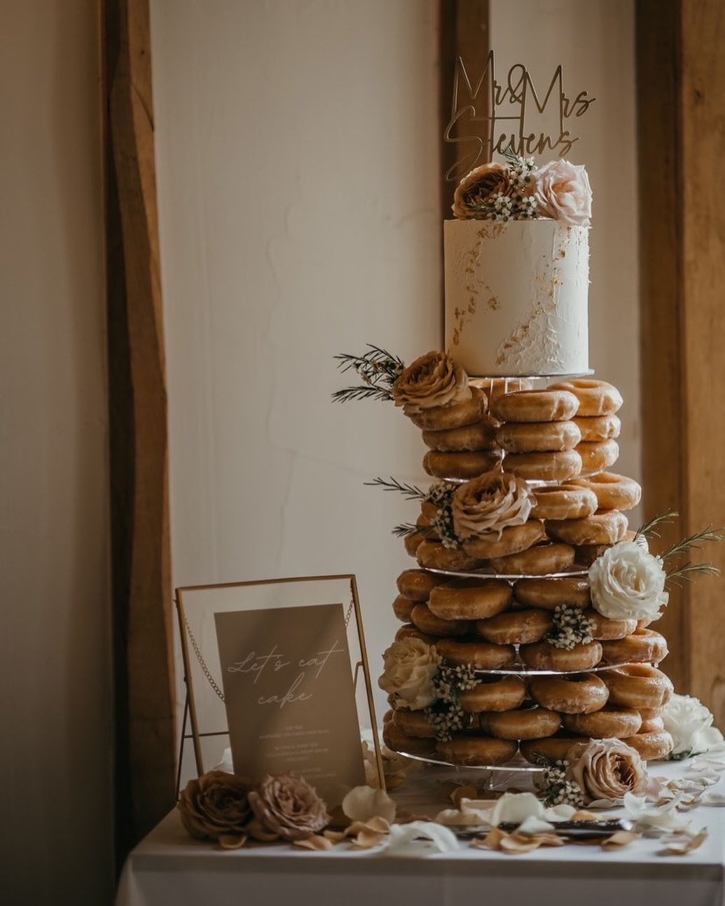 wedding cake with donut towers via sweetpeascakeboutique