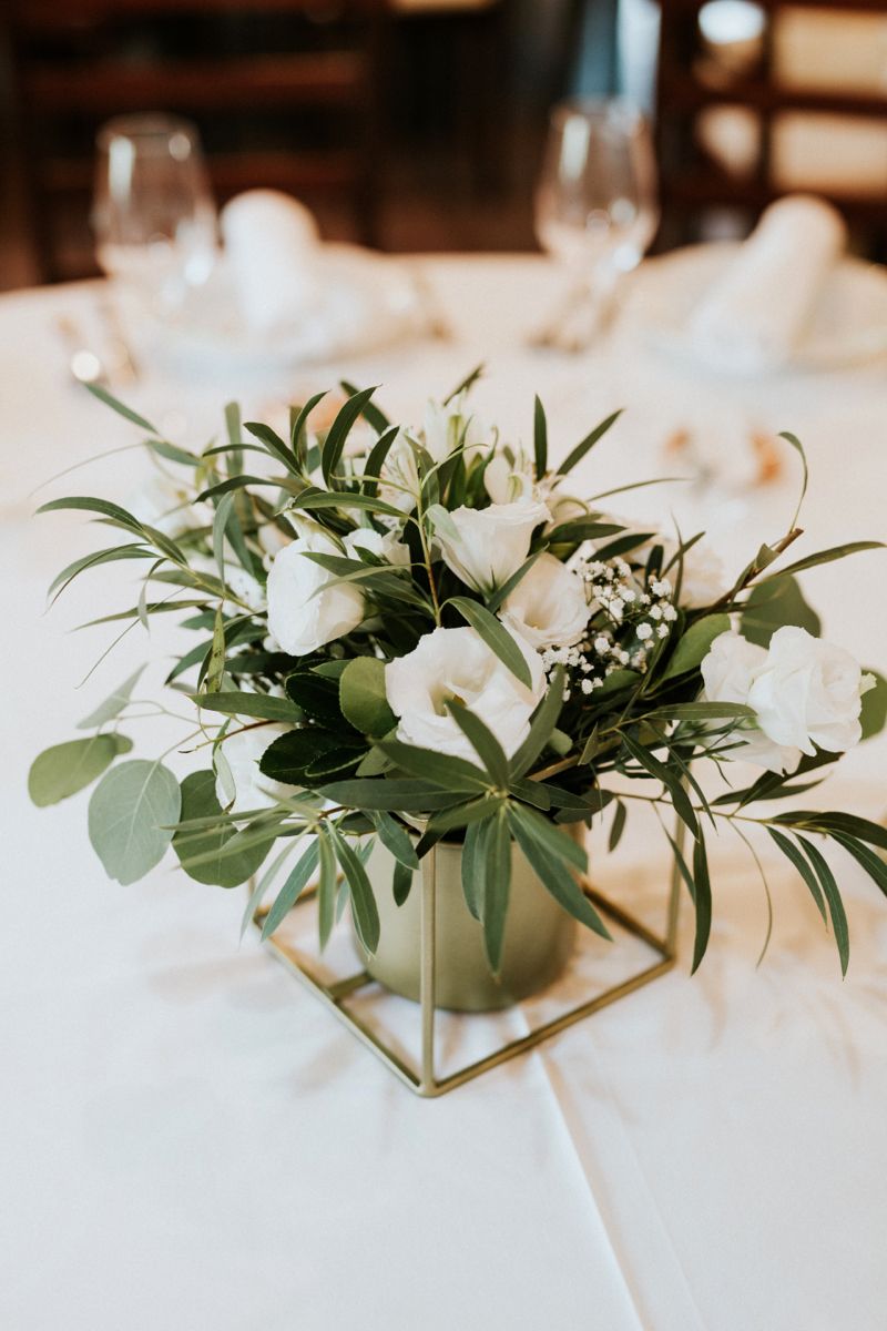 white flowers and eucalyptus wedding centerpiece