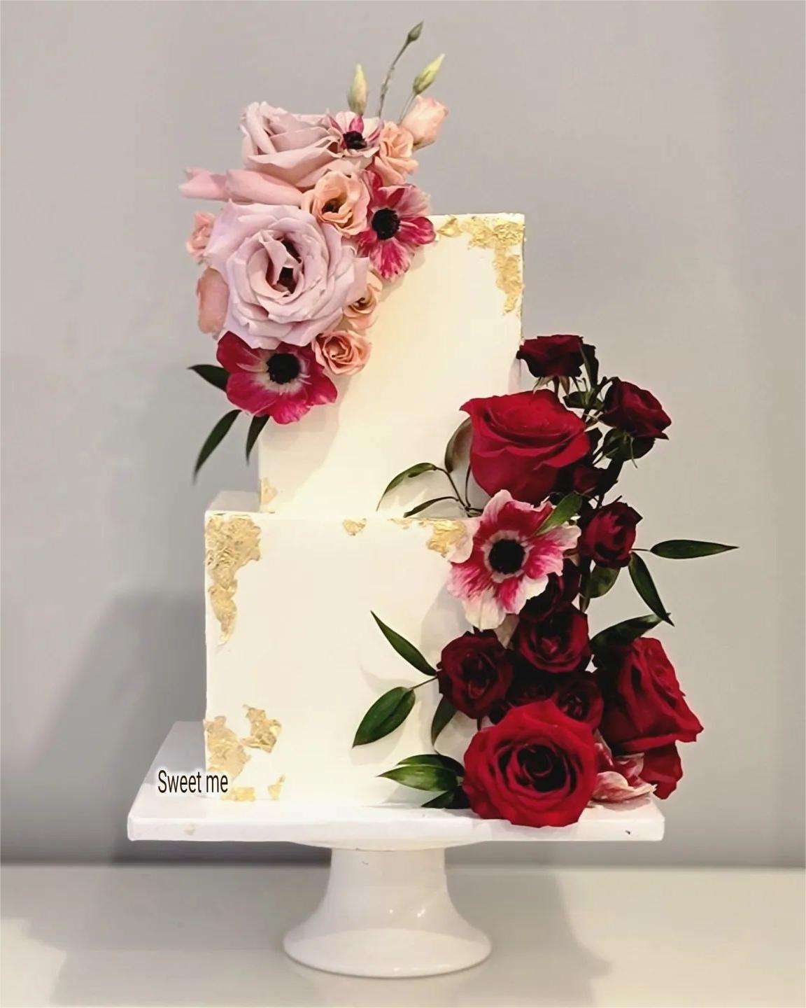 2 tier square wedding cake with dusty roses and burgundy flowers via sweetmedesserts