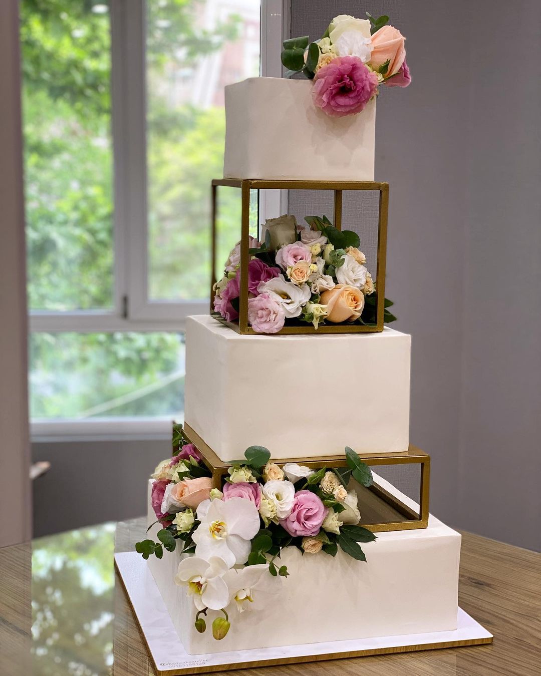 3 tier square wedding cake with flowers layered via shadicakeatelier