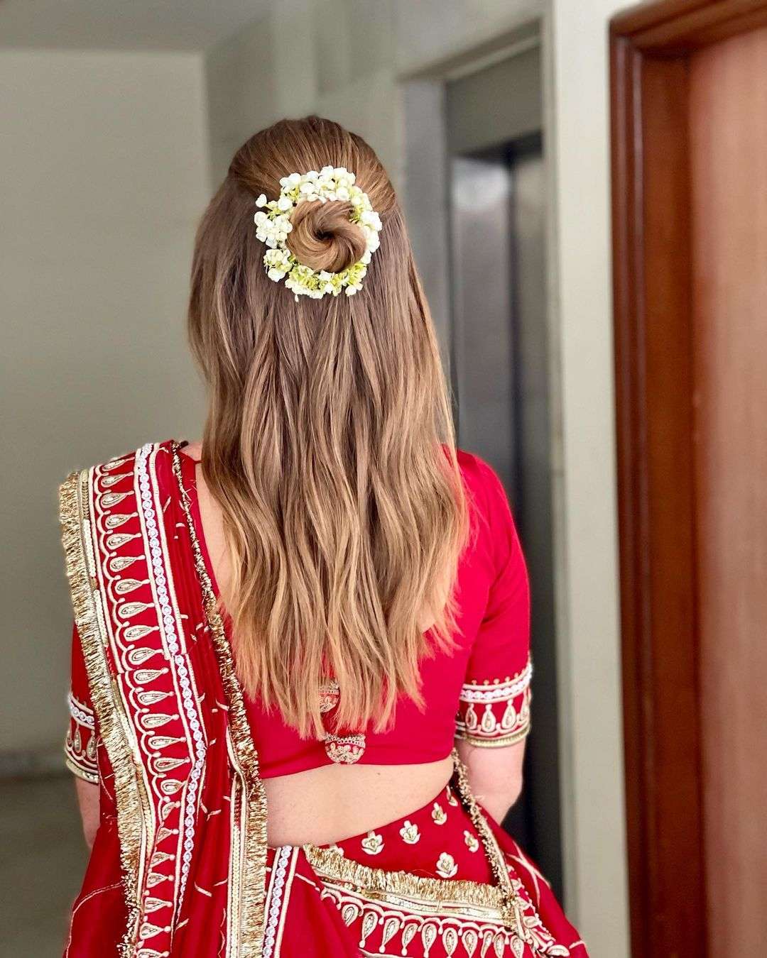 Elegant Low Bun Hairstyle with Real Flower Gajra