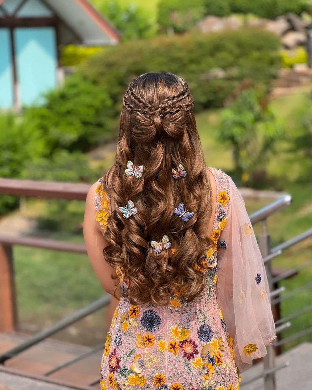 Multi Butterflies and butterfly bun half up half down indian wedding hairstyle via hairbyanishanagpal