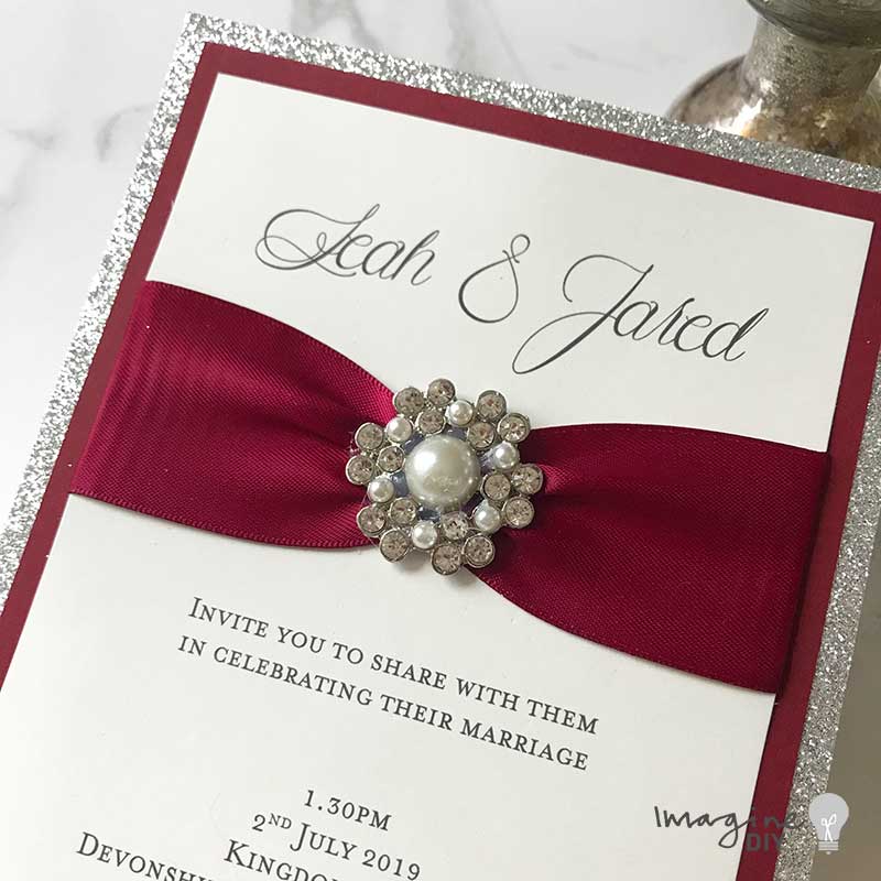 Silver glitter invitation with pearl decoration