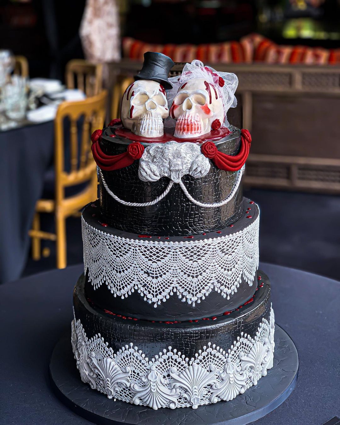 black halloween wedding cake with white lace and skulls via sugarliciousdesign
