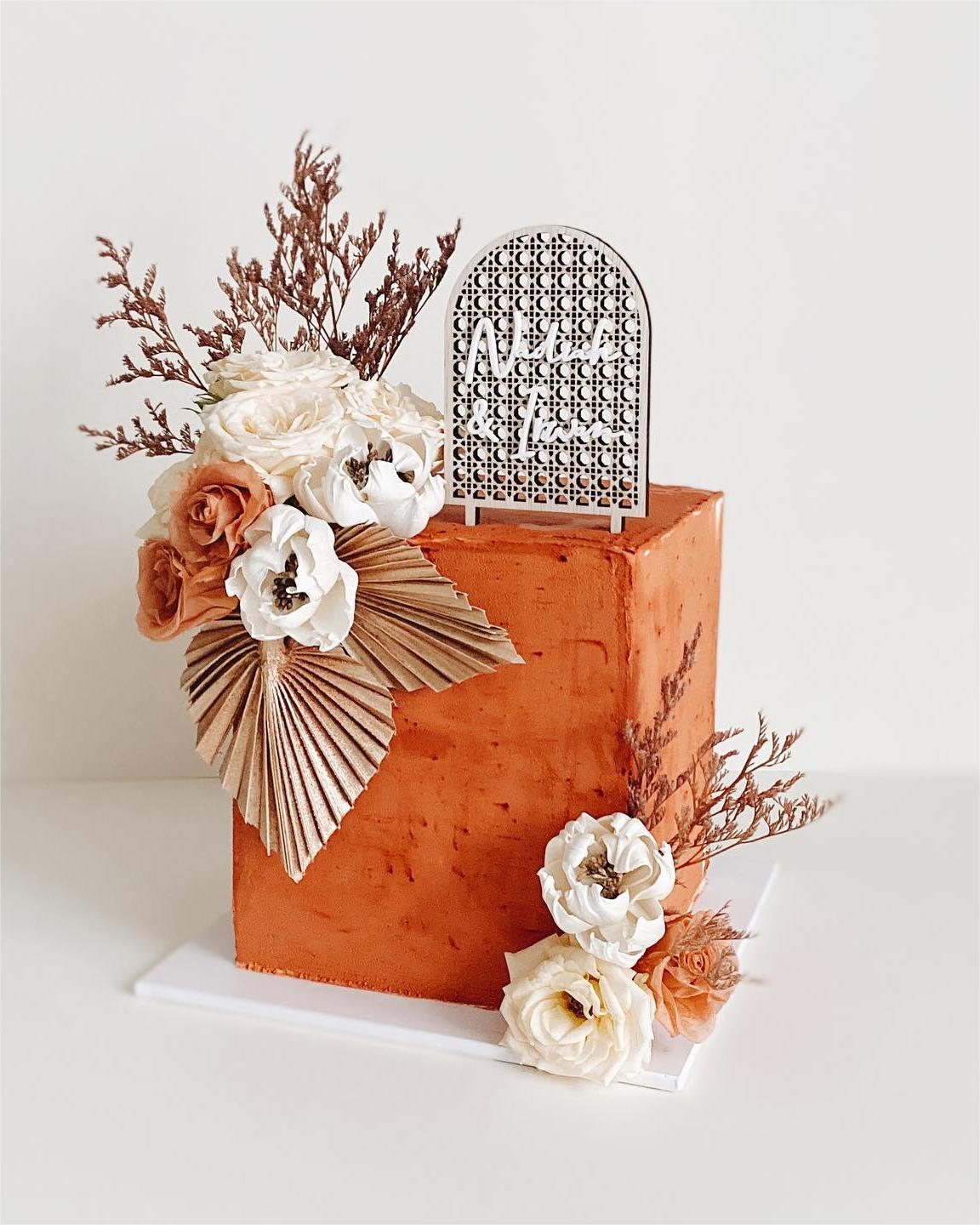 bohemian one tier square wedding cake with artificial flowers via atherealbakery