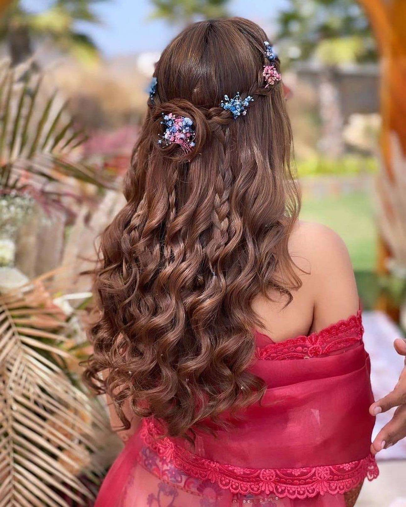 curly half up half down indian wedding hairstyle