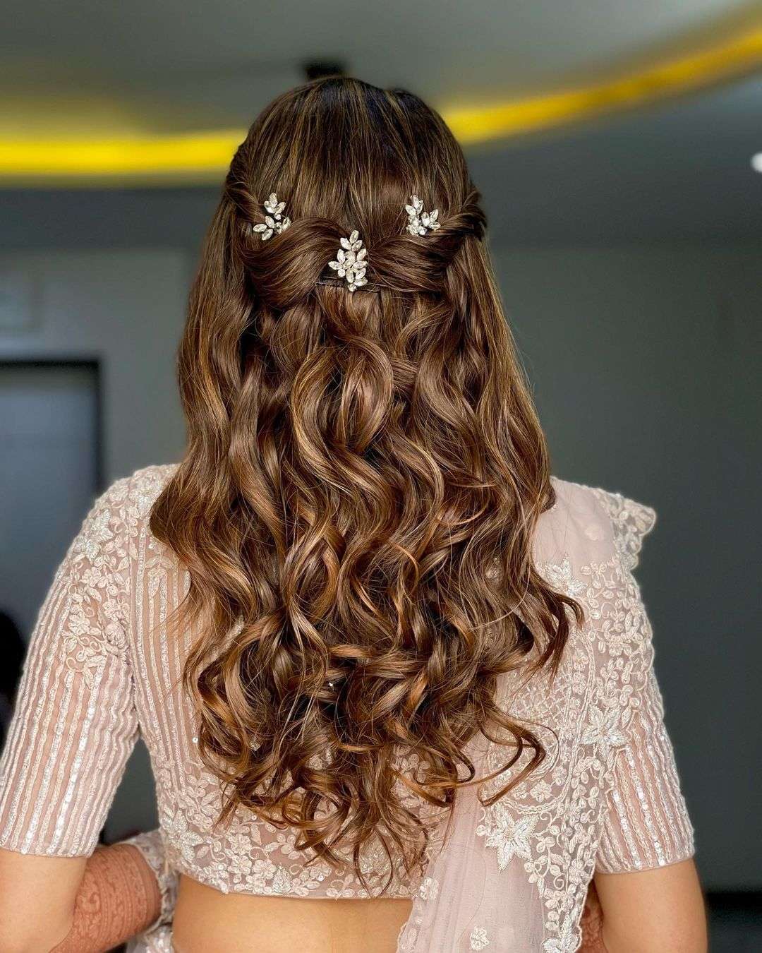 elegant half up half down indian wedding hairstyle via hairbypratiksha