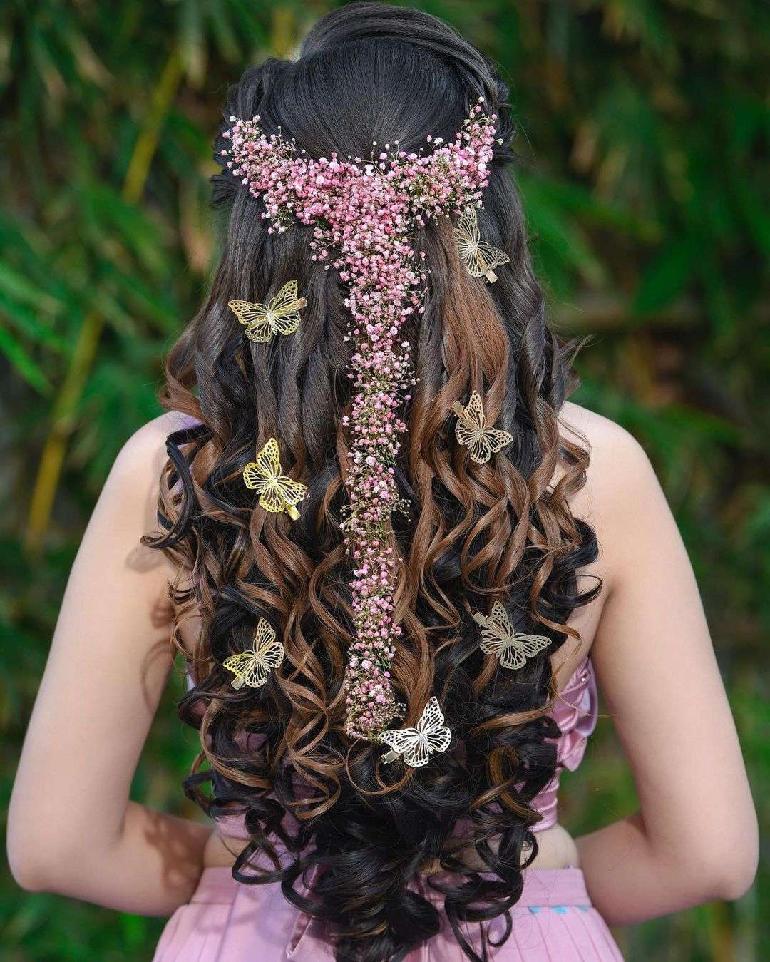 half up half down indian wedding hairstyle with pink flowers via aayushimakeup