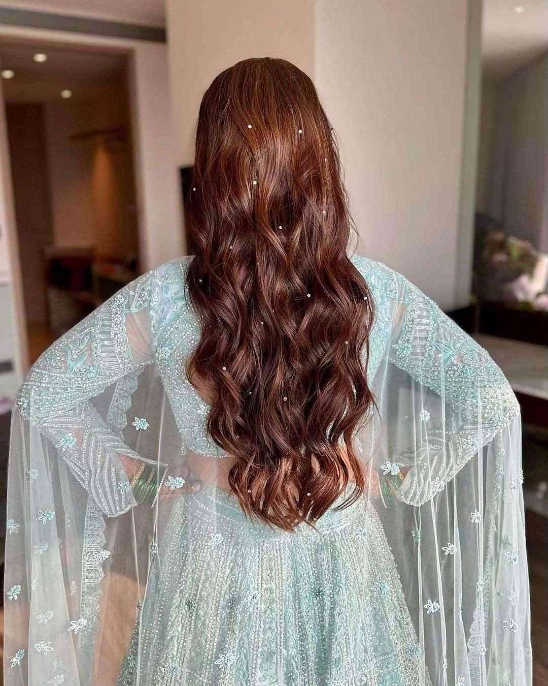 long wavy india wedding hairstyle via hairbypratiksha