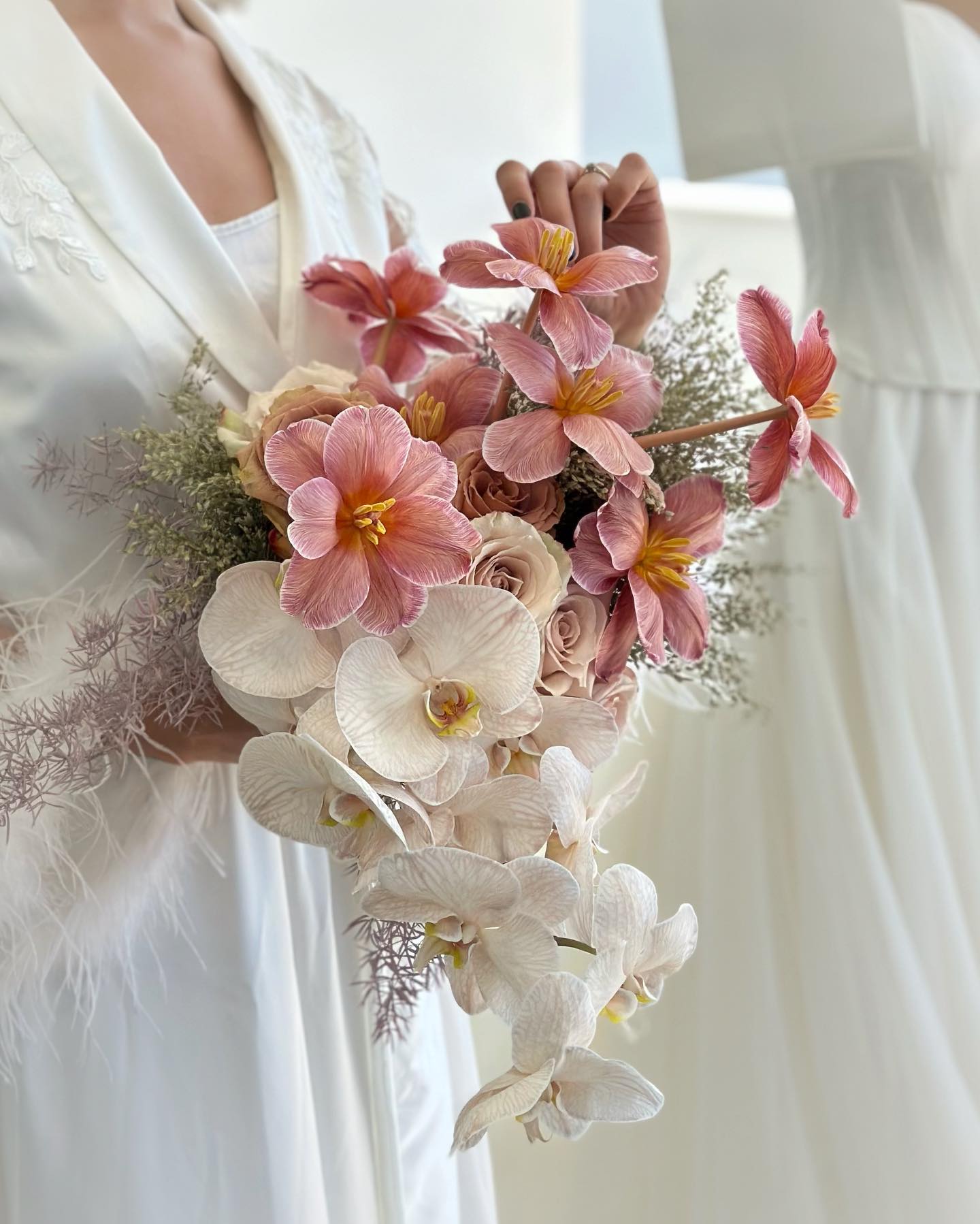 pink tulips and white orchids wedding bouquet