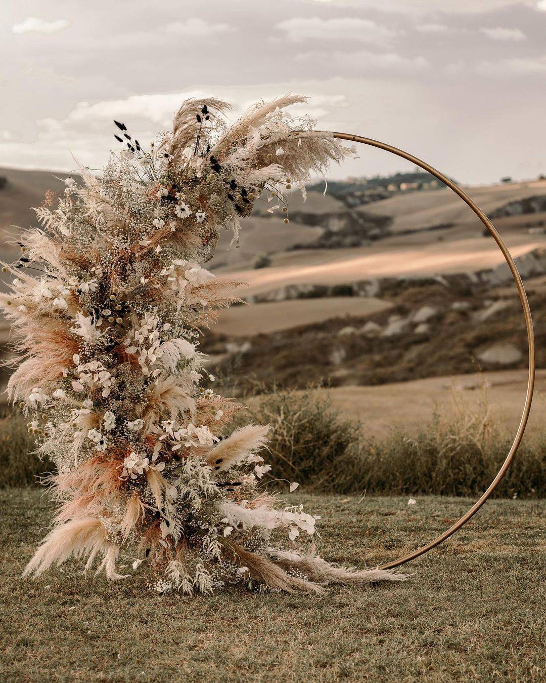 rustic bohemian pampas circle wedding backdrop via flowersliving