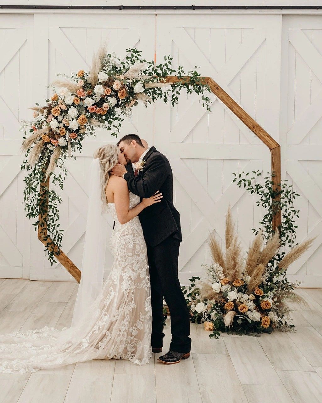 rustic boho hexagon wooden wedding arbor with pampas grass