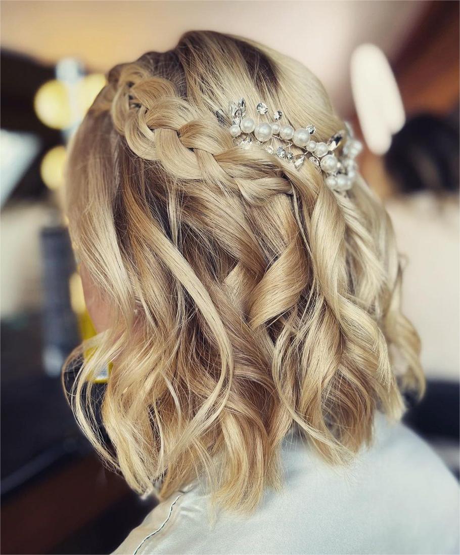 short half up half down prom hairstyle with braided crown via cindybeddard_bridalhair