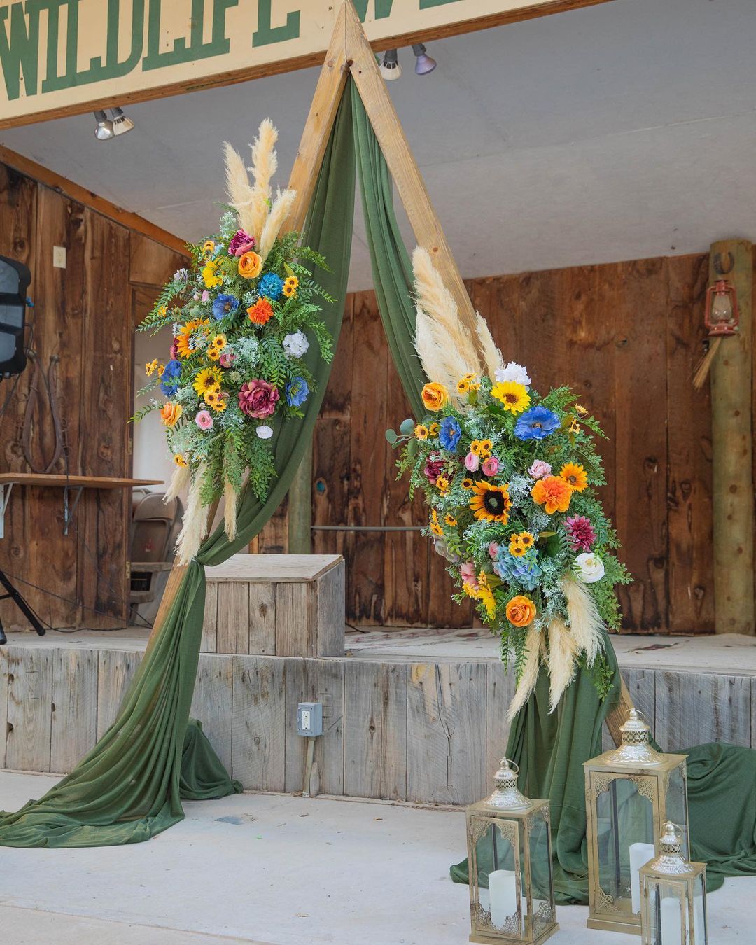 simple backyard bohemian forest green triangle wedding arch via tiffanyburkeevents