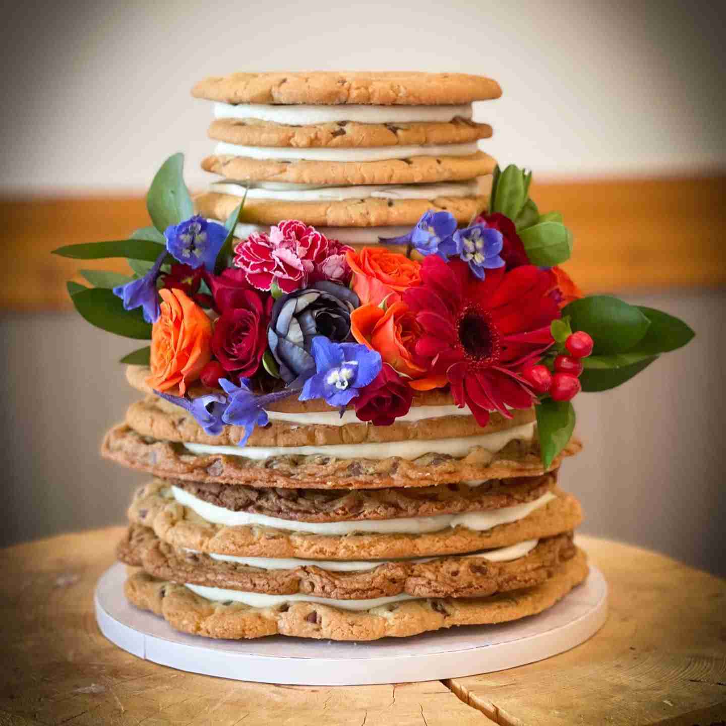 single layer cookie wedding cake with jewel color flowers