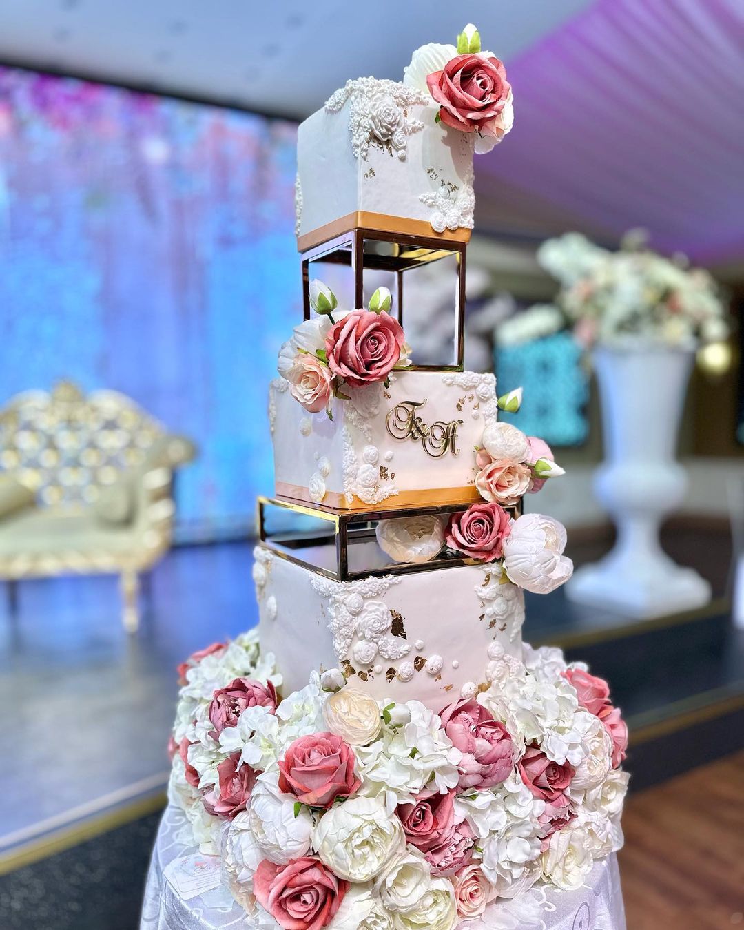 vintage square wedding cake with pink and white artificial flowers via creative.cakes.by.naz