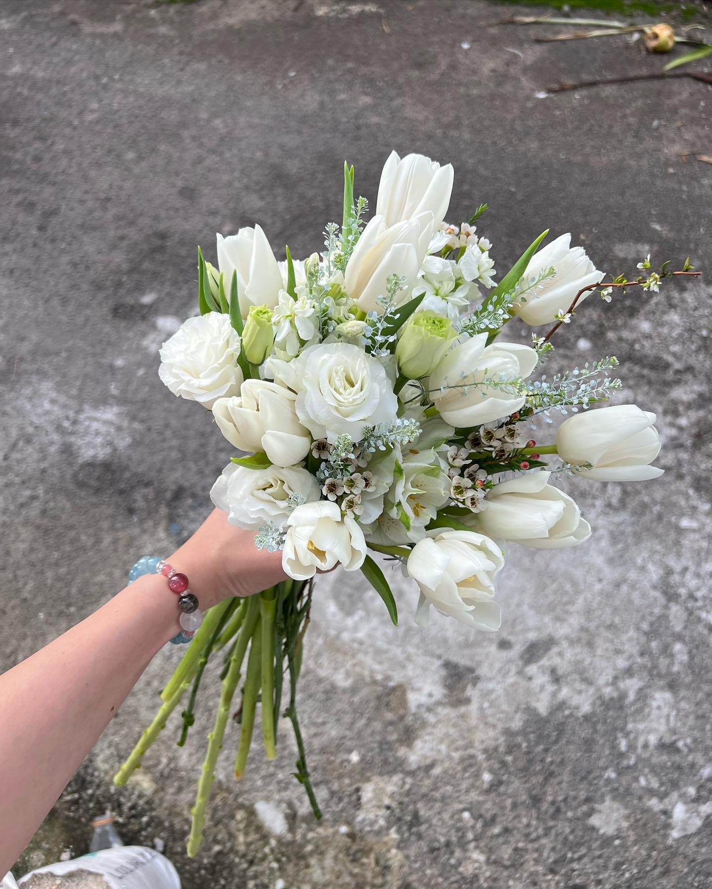 white roses and tulips wedding boqueut