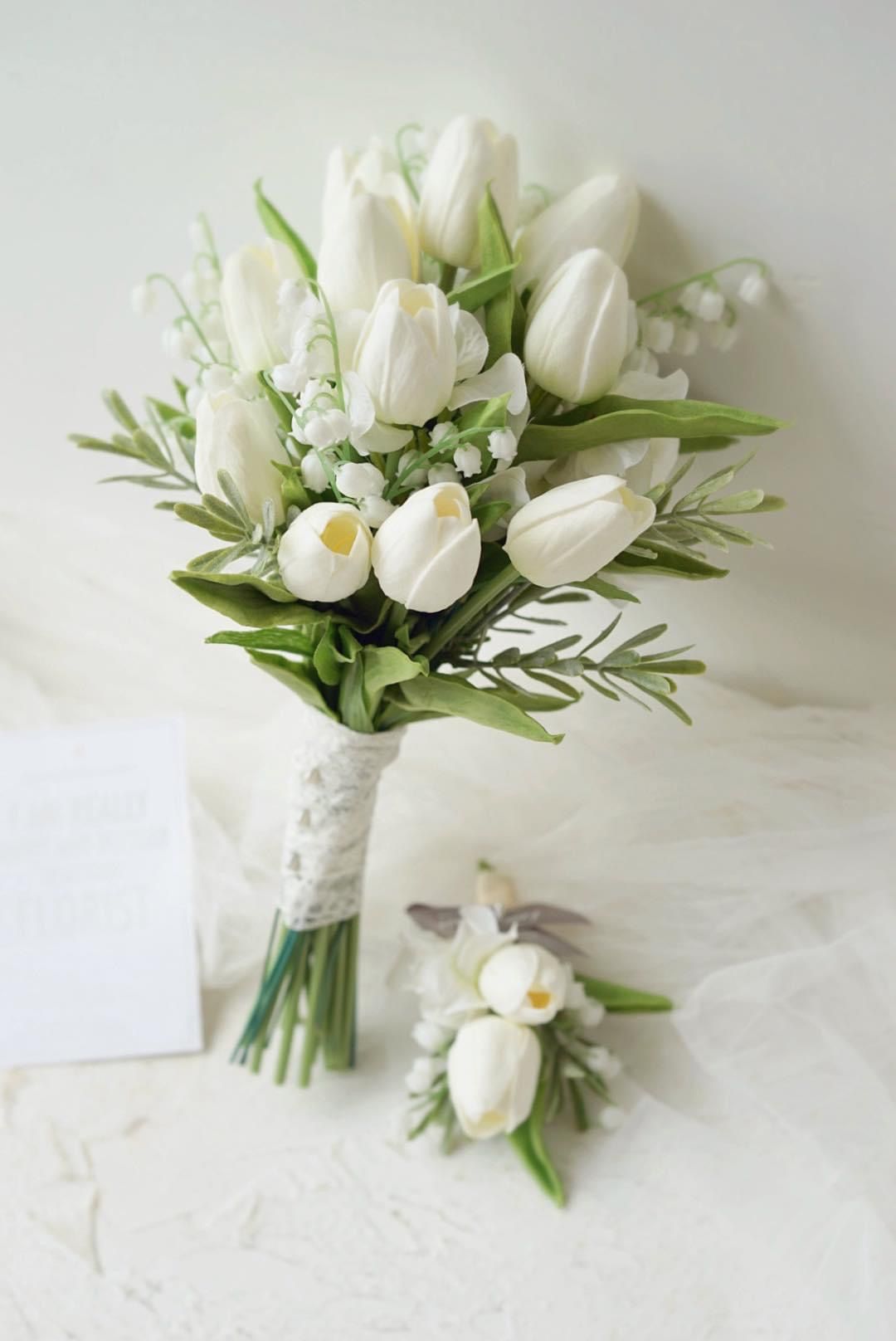 white tulip and lily of the valley wedding bouquet