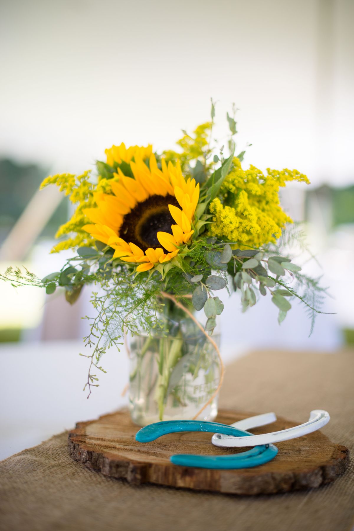 Rustic Wedding Centerpieces of Sunflowers in Mason Jars on Wood Slabs