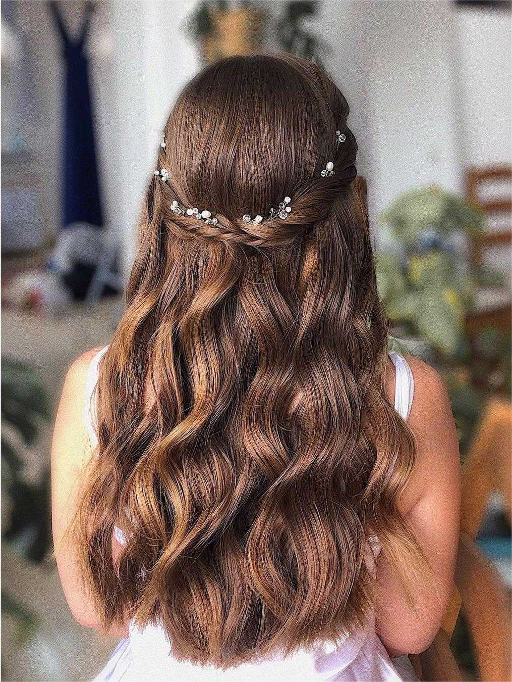 braided half up half down bridesmaid hairstyle with pearls via zhanna_syniavska