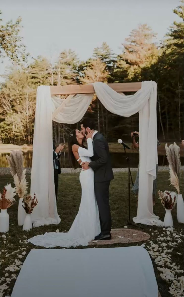elegant chic simple wood wedding arch with white fabric