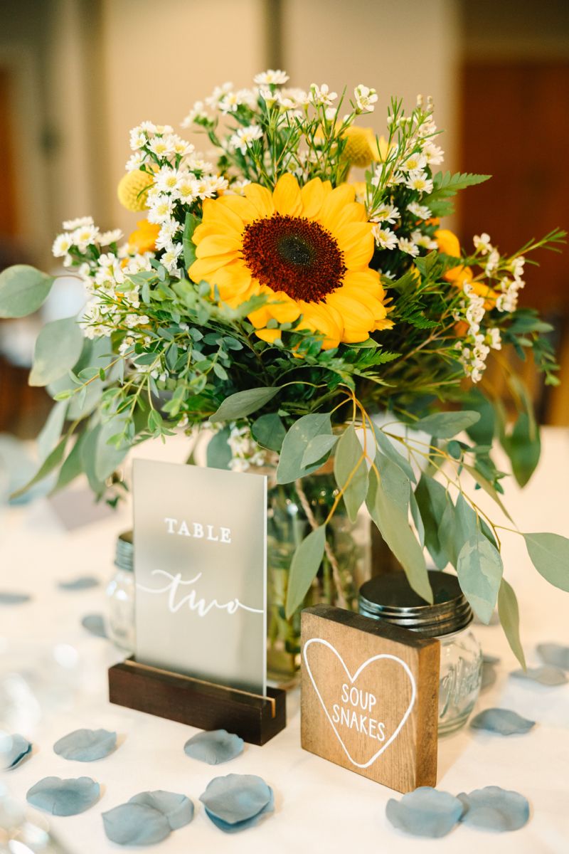 modern sunflower wedding centerpiece with forest acrylic table number