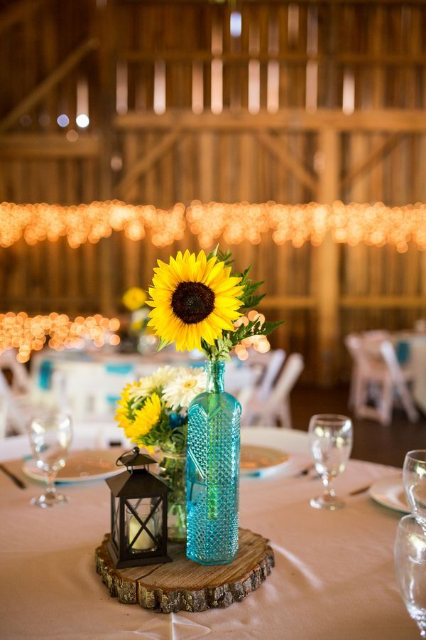rustic sunflowers and lantern wedding centerpiece