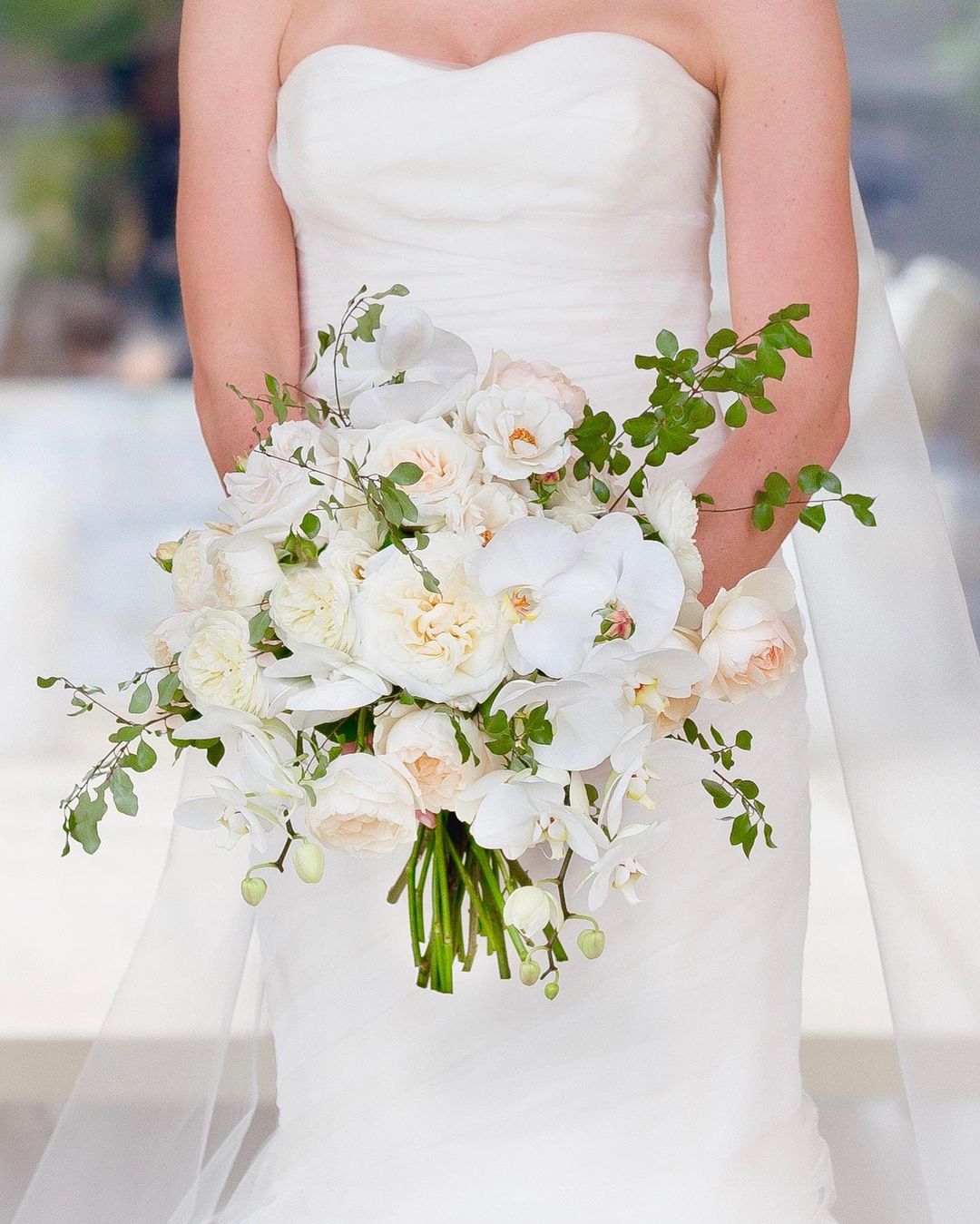 simple roses and orchids wedding bouquet via suzannekarpphotography