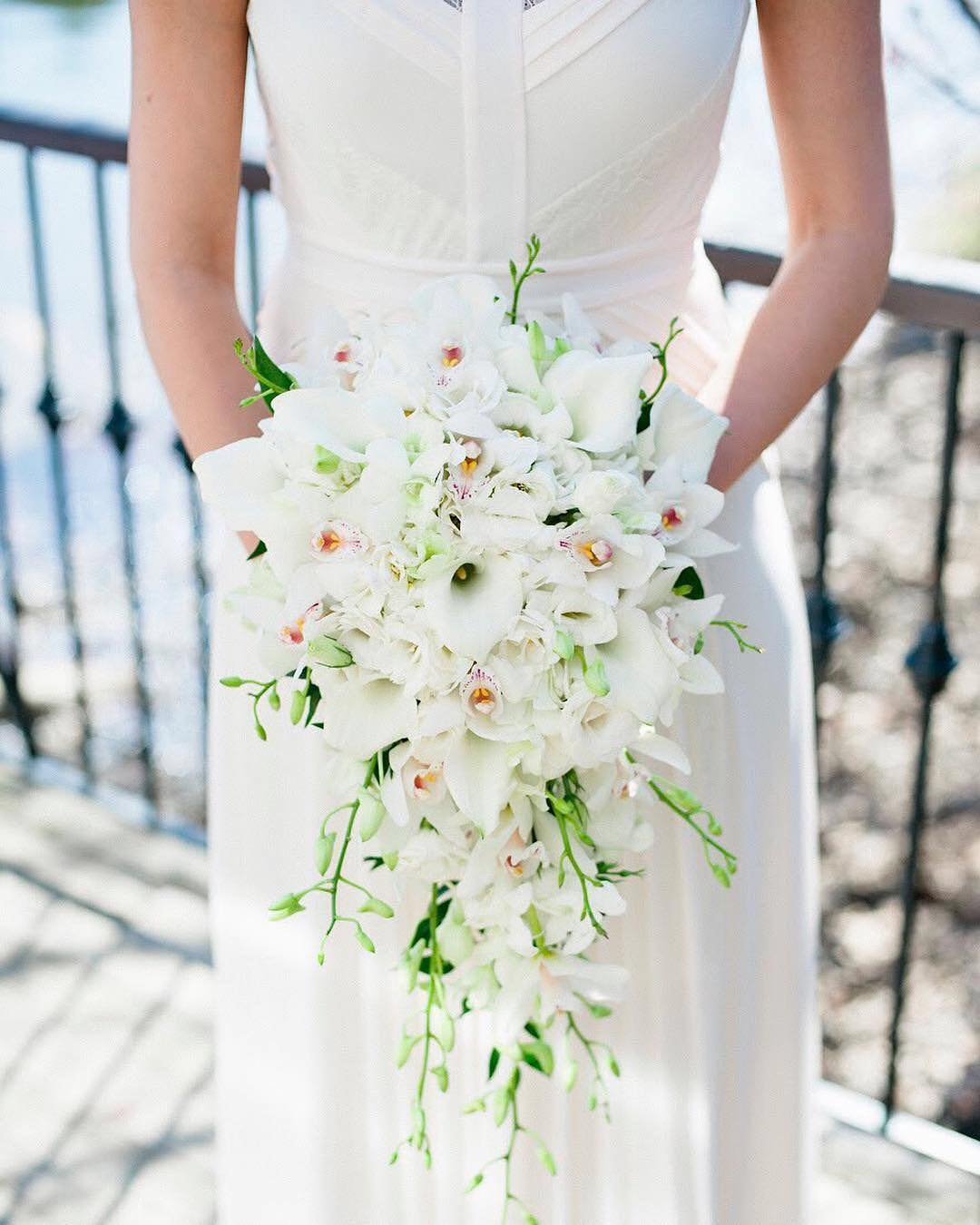 white orchids and calla lily cascading bridal bouquet via everylastdetailblog