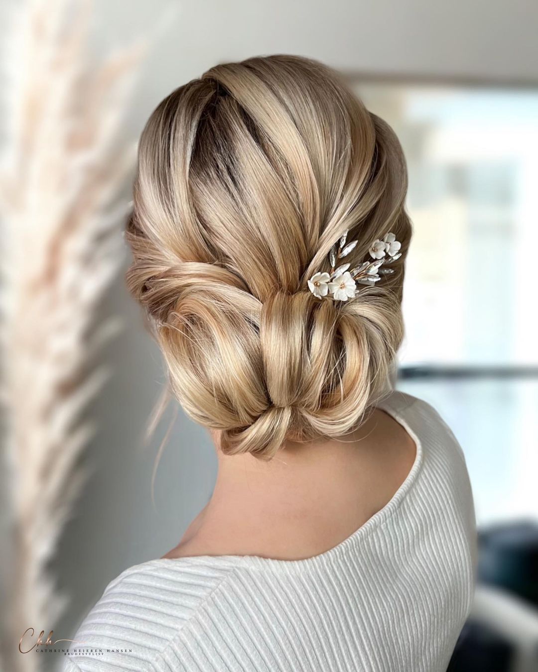 Classic chignon wedding updo via cathrineheierenhansen