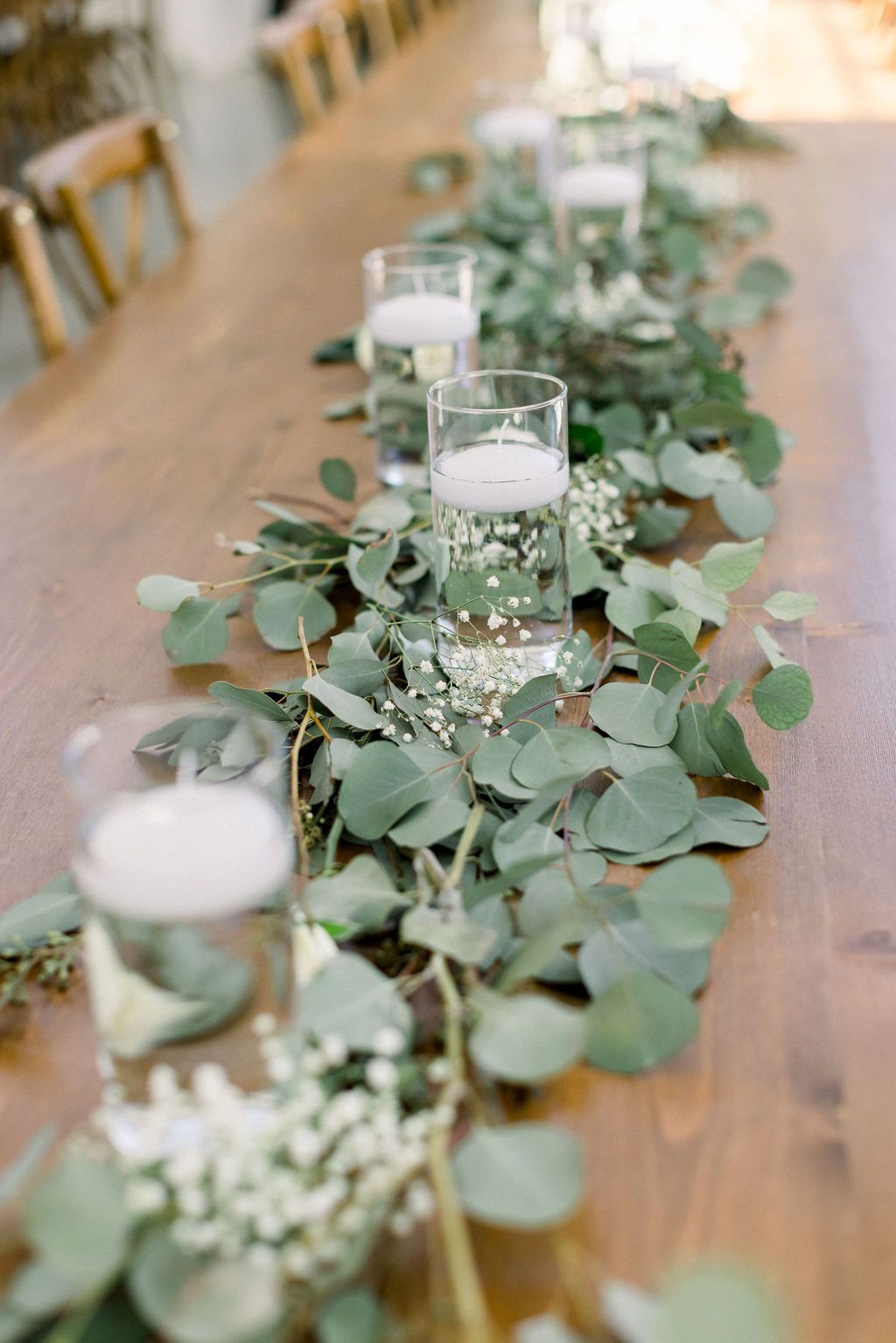 Eucalyptus baby's breath and candles wedding table runner
