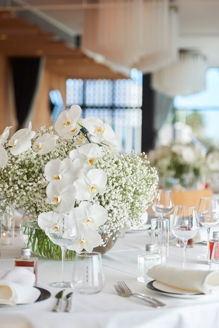 White orchid and babys breath wedding reception centrepiece