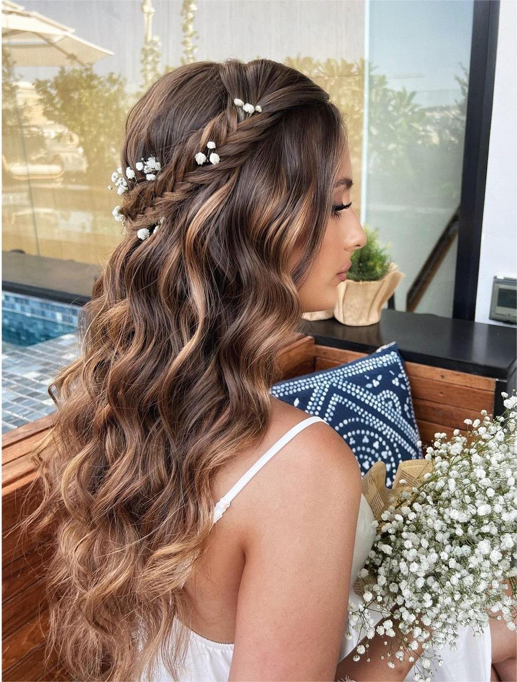 boho braided crown half up half down hairstyle with flowers via zhanna_syniavska